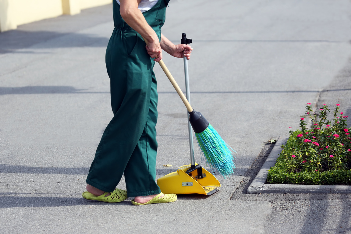 Cleaner Sweeping the Street  